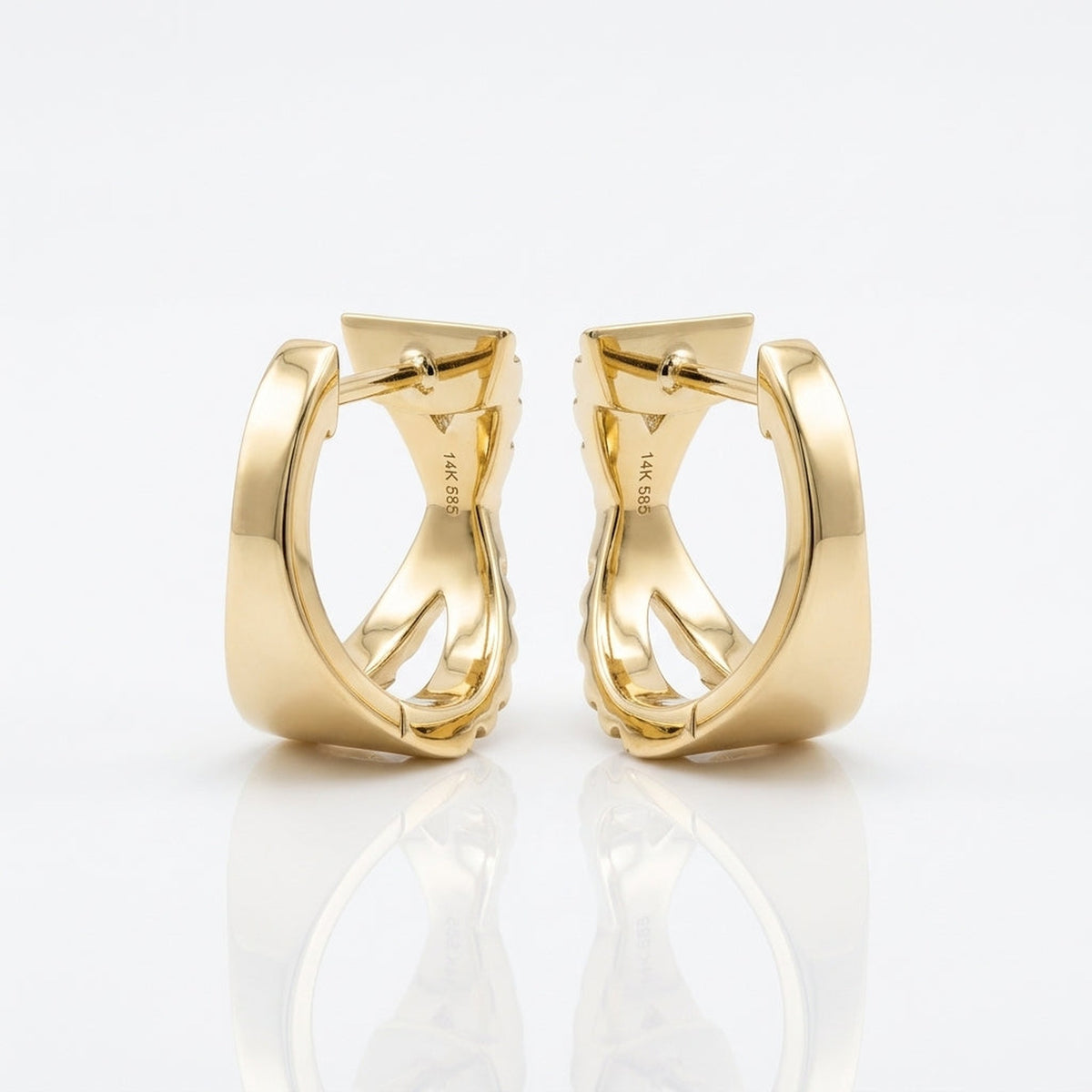 Back view of solid 14K yellow gold X huggie hoop earrings showing the polished gold construction and hinged post closures.