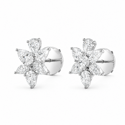 A pair of silver-toned stud earrings featuring a six-stone flower cluster with pear shaped diamonds, shown on a plain white background.