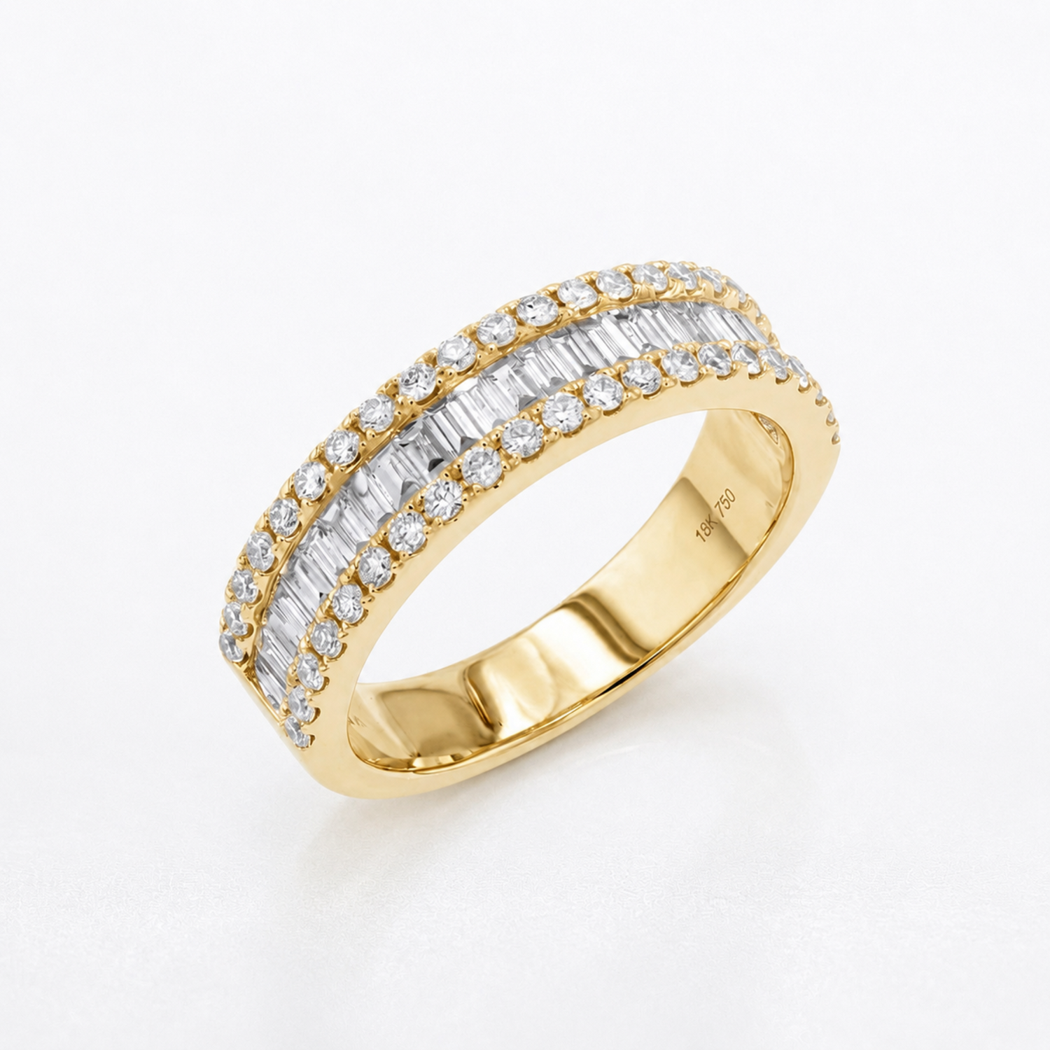 A yellow gold eternity ring featuring two rows of baguette-cut and round diamonds, shown on a clean white background.