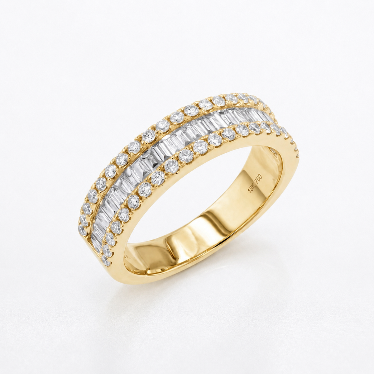 A yellow gold eternity ring featuring two rows of baguette-cut and round diamonds, shown on a clean white background.
