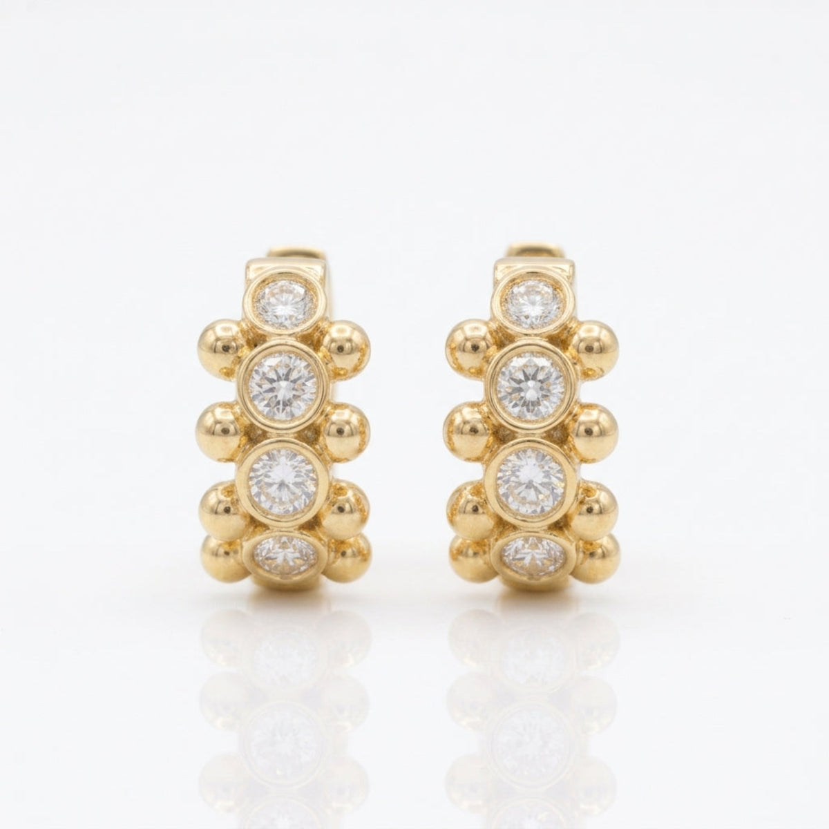 18K yellow gold Orbi Collection natural diamond bezel and gold bead huggie earrings, front view