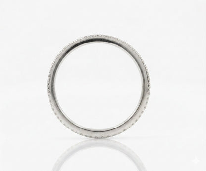 A silver-toned ring with a textured, beaded outer edge, shown on a clean white reflective surface.
