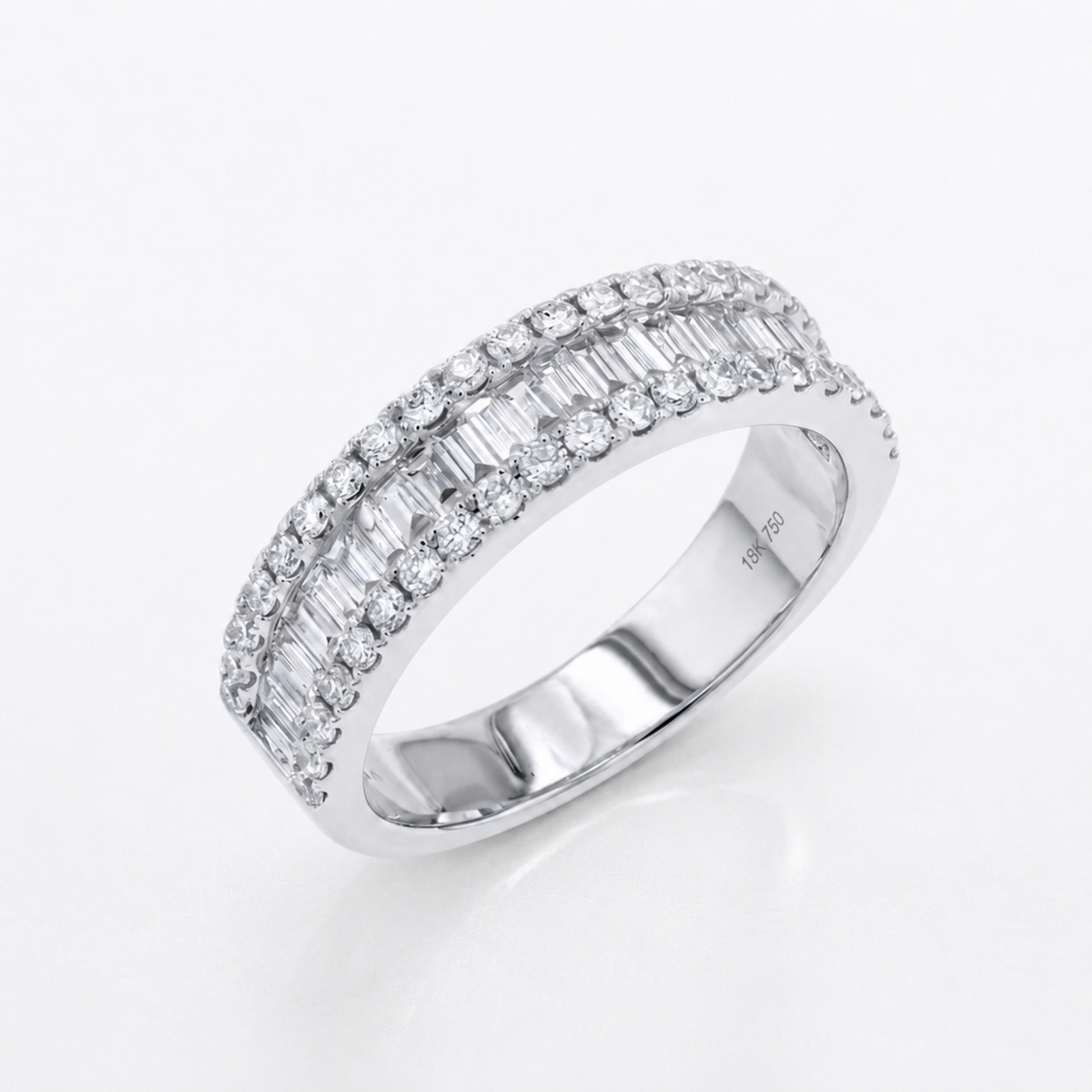 A silver-tone diamond ring with two rows of baguette and round-cut diamonds, shown on a clean white background.
