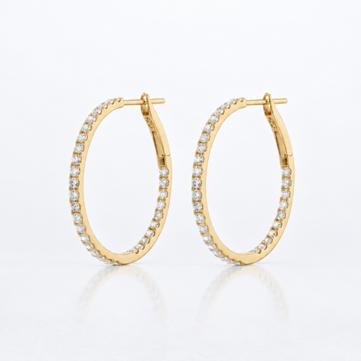Pair of 1-inch natural diamond inside-out hoop earrings in solid 18K yellow gold.