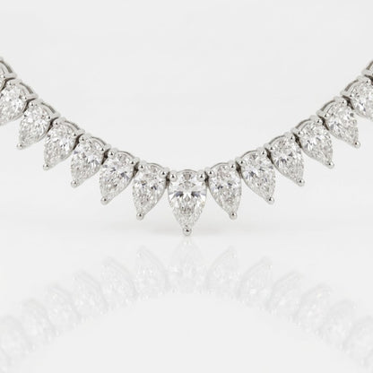 Close-up of graduated pear-shaped natural diamonds at the center of the 18K white gold diamond tennis necklace