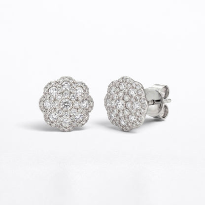 A pair of round cluster stud earrings in silver-tone metal, featuring pavé-set clear diamonds and a post-back closure, shown on a clean white background.