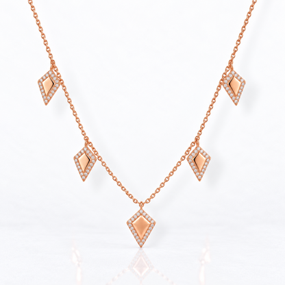 Full view of 14K rose gold five kite charm necklace with natural diamonds and adjustable cable chain.