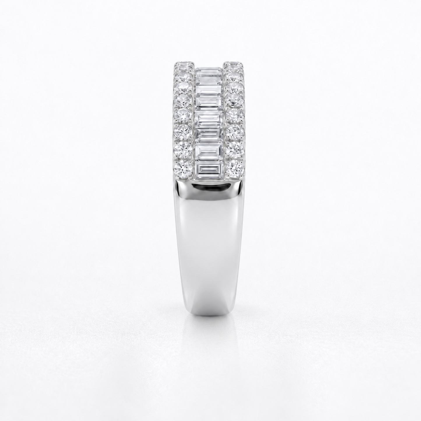 A white gold or platinum ring featuring a double row of baguette and round-cut diamonds, shown from the front on a clean white background.