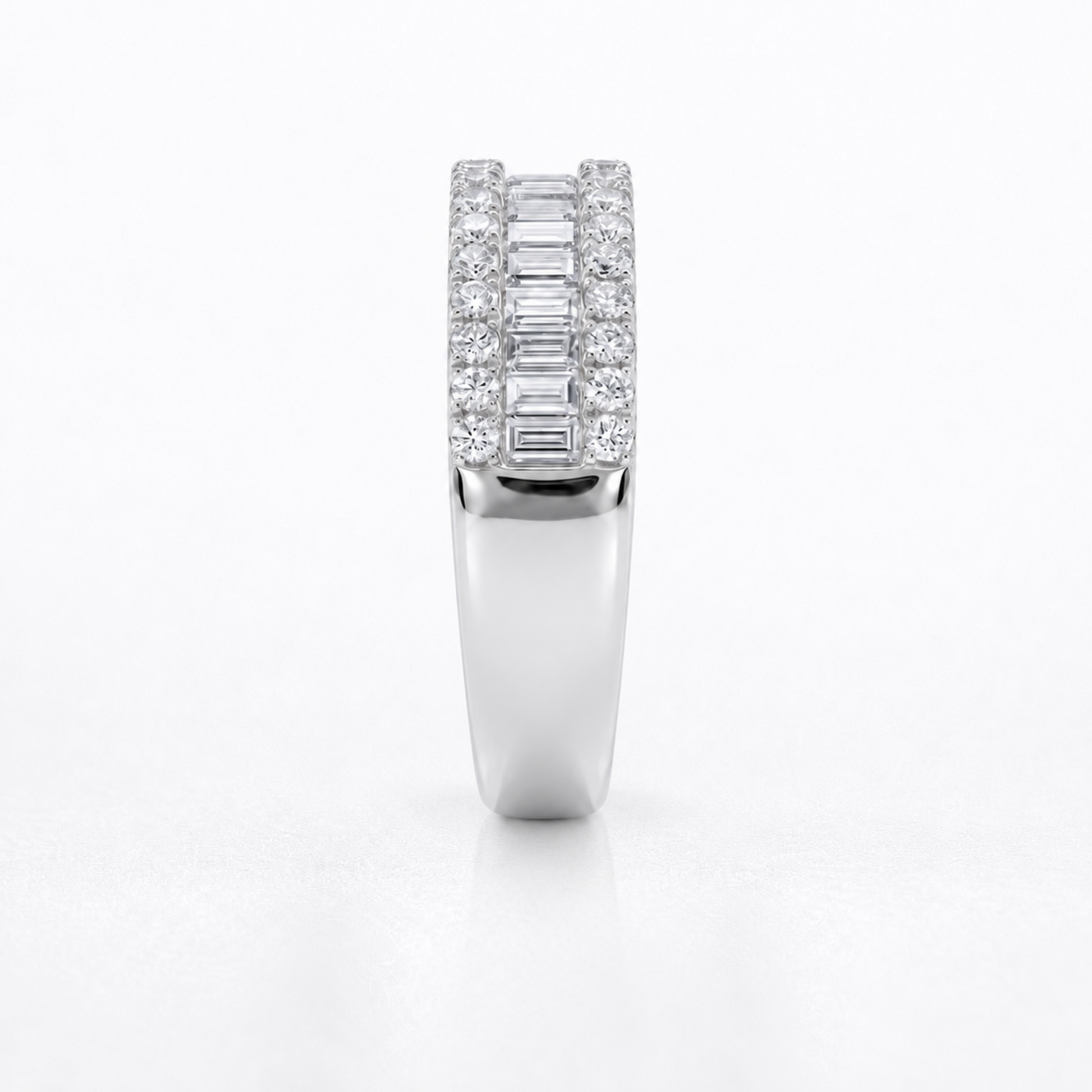 A white gold or platinum ring featuring a double row of baguette and round-cut diamonds, shown from the front on a clean white background.