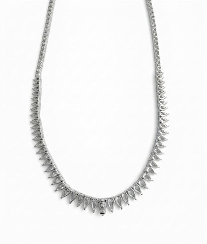 Reverse view of the 18K white gold pear-shaped and round natural diamond tennis necklace showing the stone settings