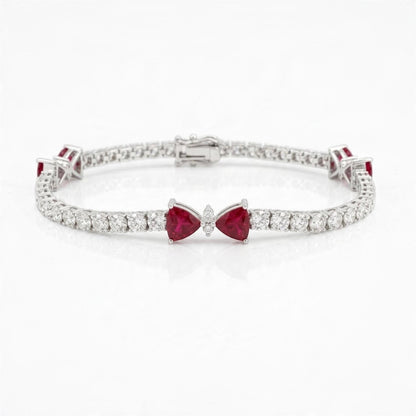 18K white gold natural ruby and diamond bow tennis bracelet, 7.58 ctw