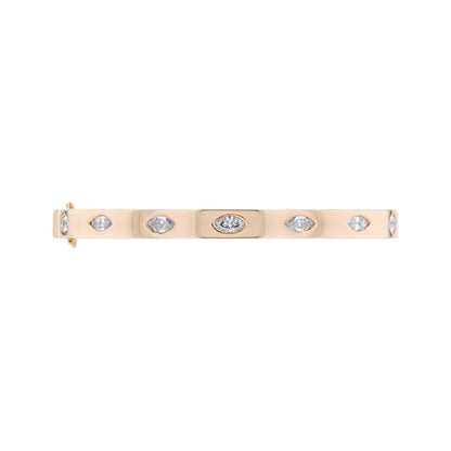 A slim rose gold bangle bracelet featuring seven marquise shaped diamonds spaced along the band, shown against a plain white background.