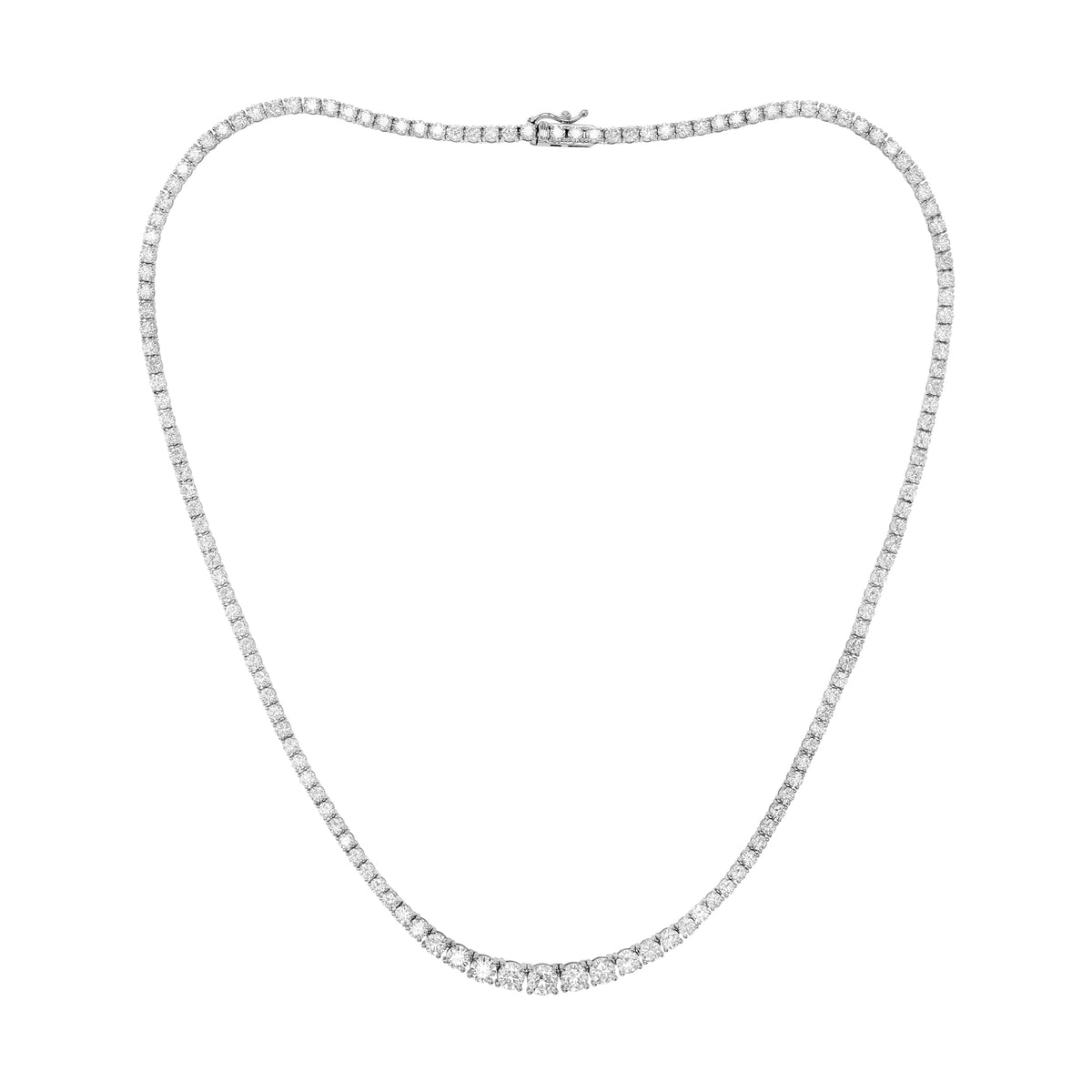 A silver tennis necklace with a continuous row of small clear diamonds, displayed in a heart shape against a plain white background.