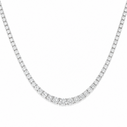 A silver tennis necklace paved with small round-cut clear diamonds, shown against a plain white background.
