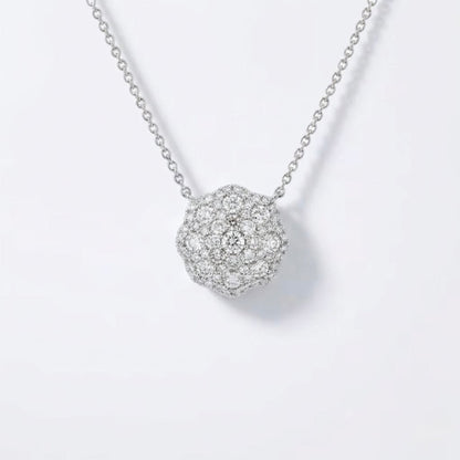 A silver pavé ball pendant necklace with a delicate chain, displayed on a clean white background.