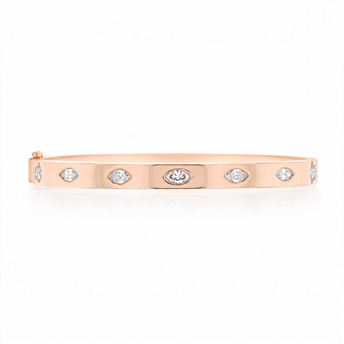 A rose gold bangle bracelet with marquise-cut diamonds set along the front, displayed on a clean white background.