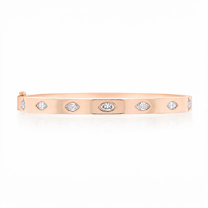 A rose gold bangle bracelet with marquise-cut diamonds set along the front, displayed on a clean white background.
