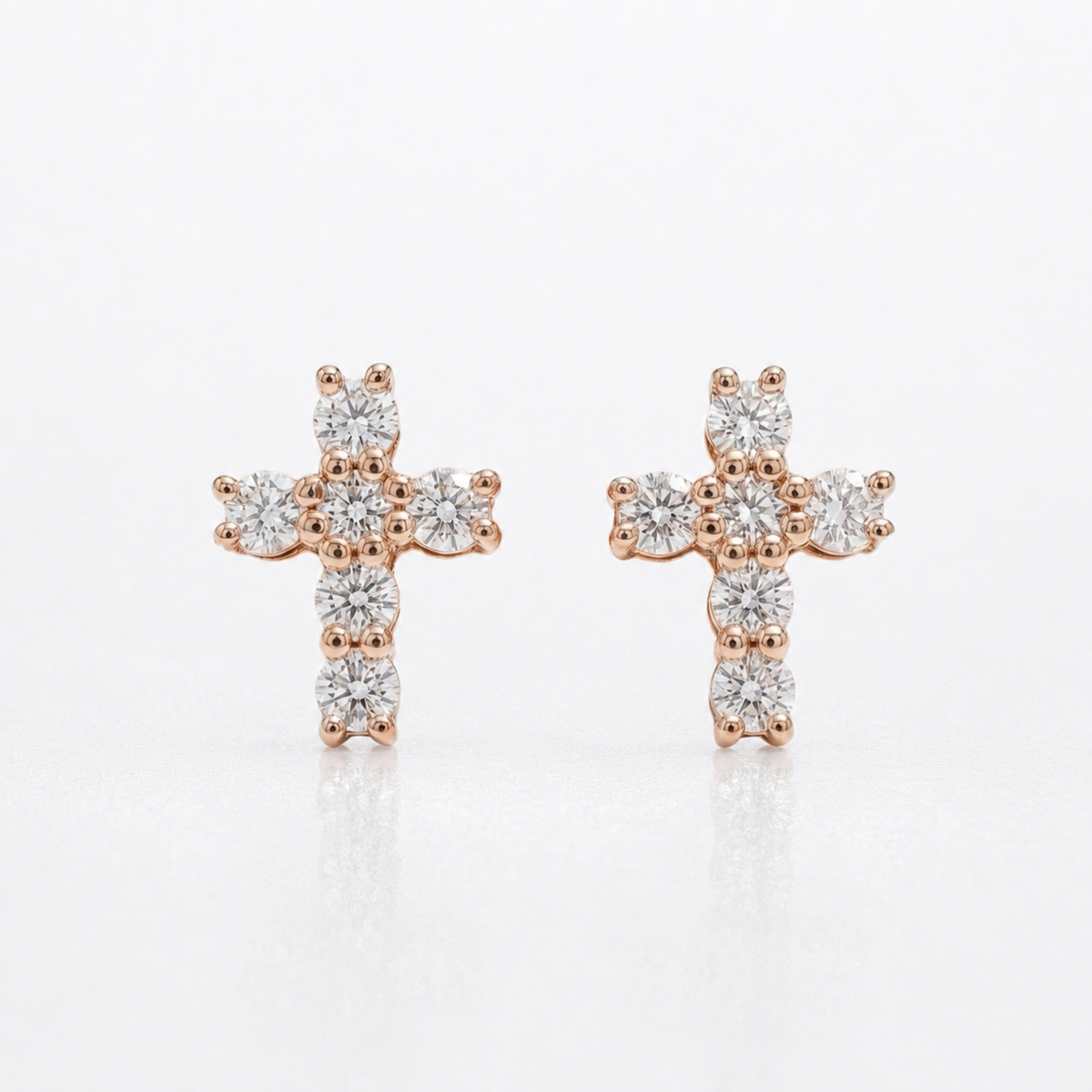 Pair of rose gold natural diamond cross stud earrings