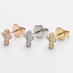 Three pairs of diamond stud earrings in rose gold, white, and yellow gold, arranged on a clean white background.
