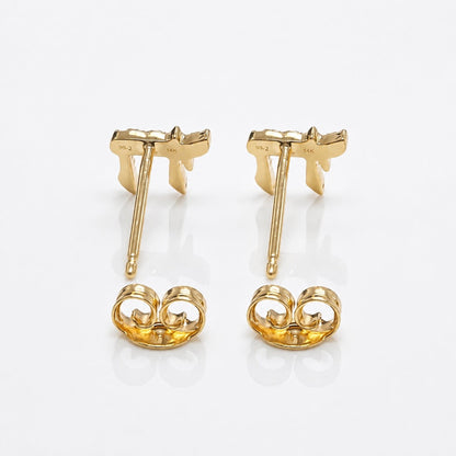 A pair of yellow gold stud earrings shown from the back on a clean white reflective surface. Each earring features a butterfly-shaped post with a matching butterfly-shaped backplate.