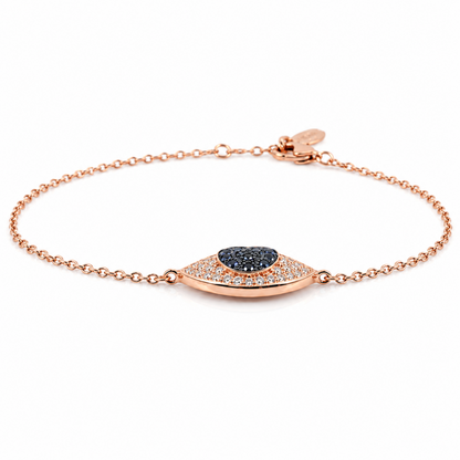A rose gold chain bracelet with a central shield-shaped pavé setting holding a dark blue-gray heart-shaped stone, photographed on a clean white background.