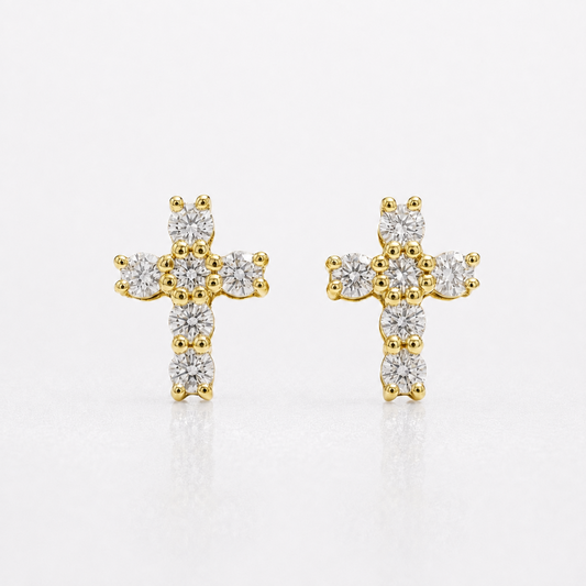 A pair of gold cross stud earrings set with round clear diamonds, displayed on a clean white background.