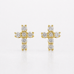A pair of gold cross stud earrings set with round clear diamonds, displayed on a clean white background.