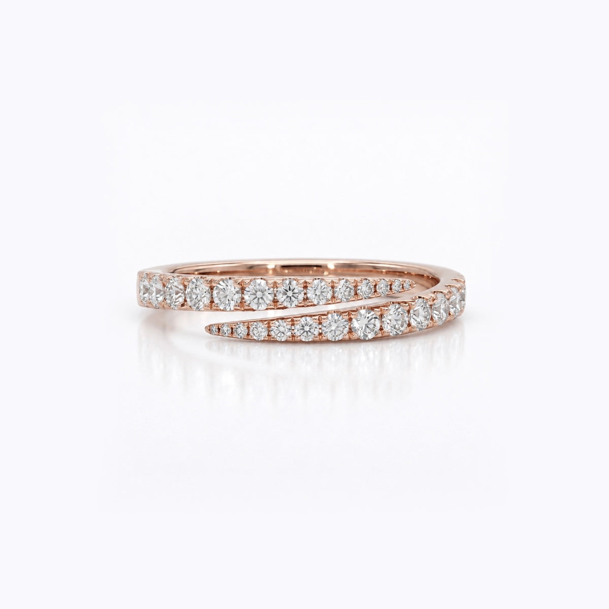 A rose gold wrap ring with pavé-set round diamonds, shown on a clean white background with a soft reflection.