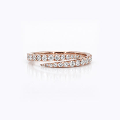 A rose gold wrap ring with pavé-set round diamonds, shown on a clean white background with a soft reflection.
