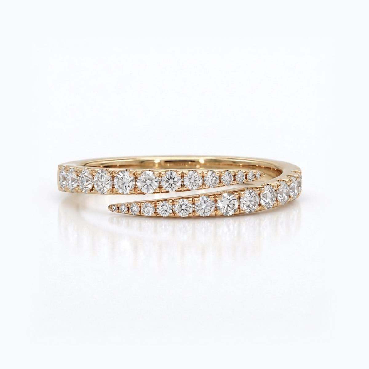 A yellow gold ring featuring two parallel rows of round-cut clear diamonds, set against a clean white background with a soft reflection.