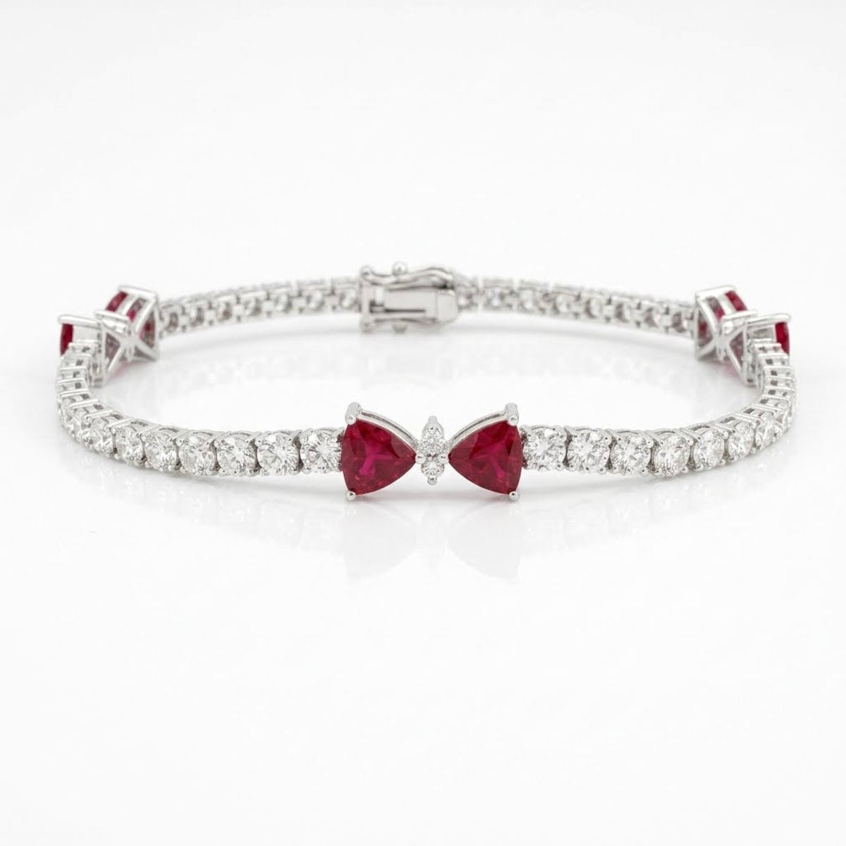 7-inch 18K white gold natural ruby and diamond tennis bracelet with three bow motifs