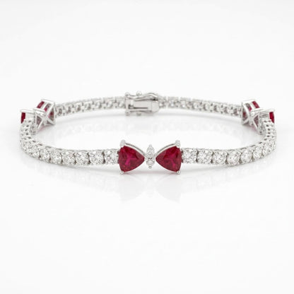 7-inch 18K white gold natural ruby and diamond tennis bracelet with three bow motifs