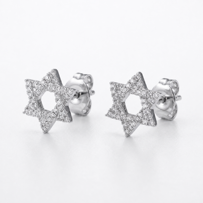 A pair of silver Star of David stud earrings paved with small diamonds, shown on a clean white background.