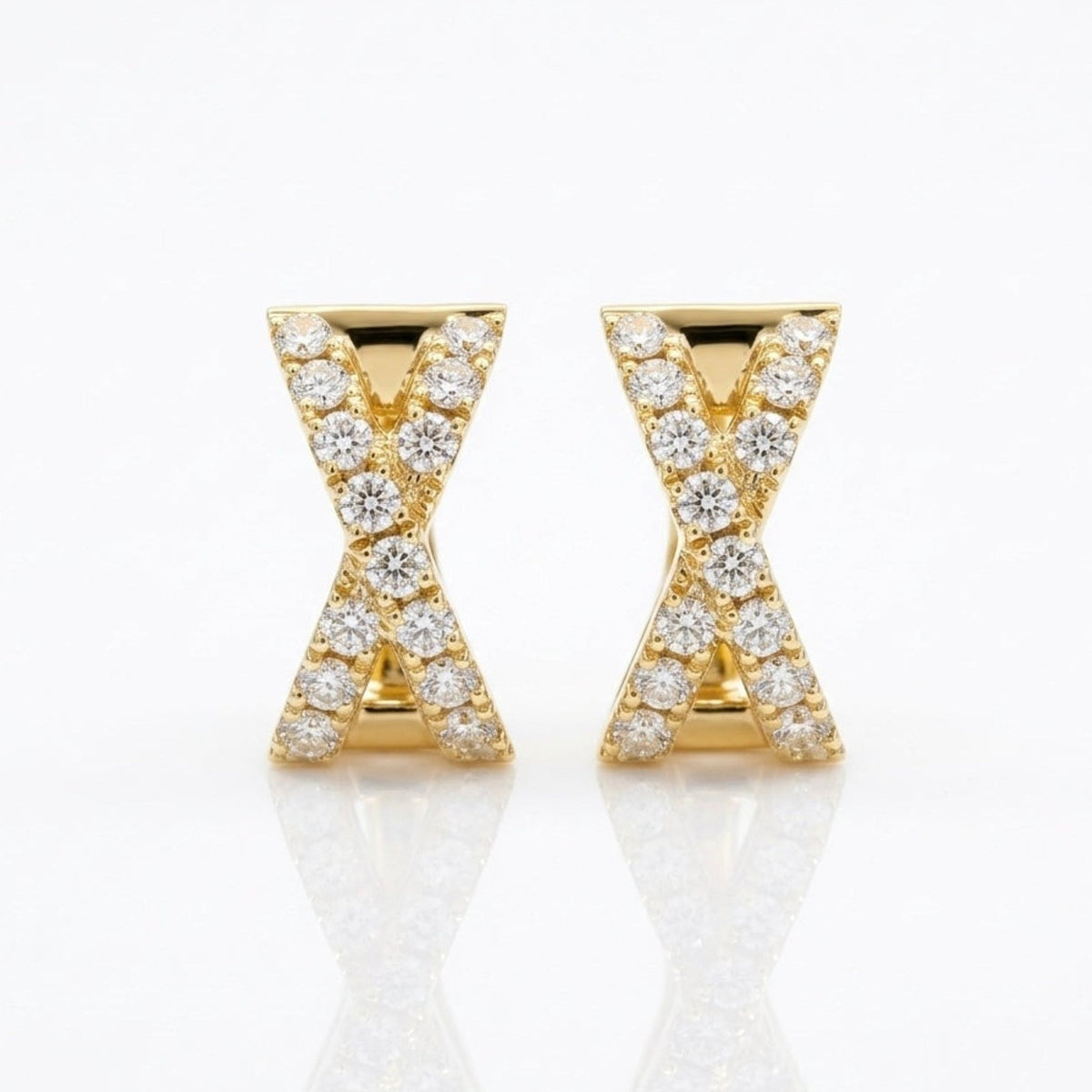 Pair of solid 14K yellow gold natural diamond X huggie hoop earrings featuring an X-shaped diamond design.