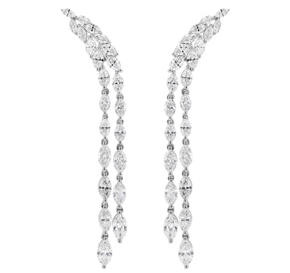 A pair of 18K white gold dangling drop earrings adorned with natural marquise diamonds.